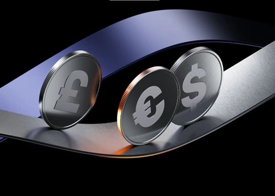 Metallic coins representing pound, euro, and dollar currencies